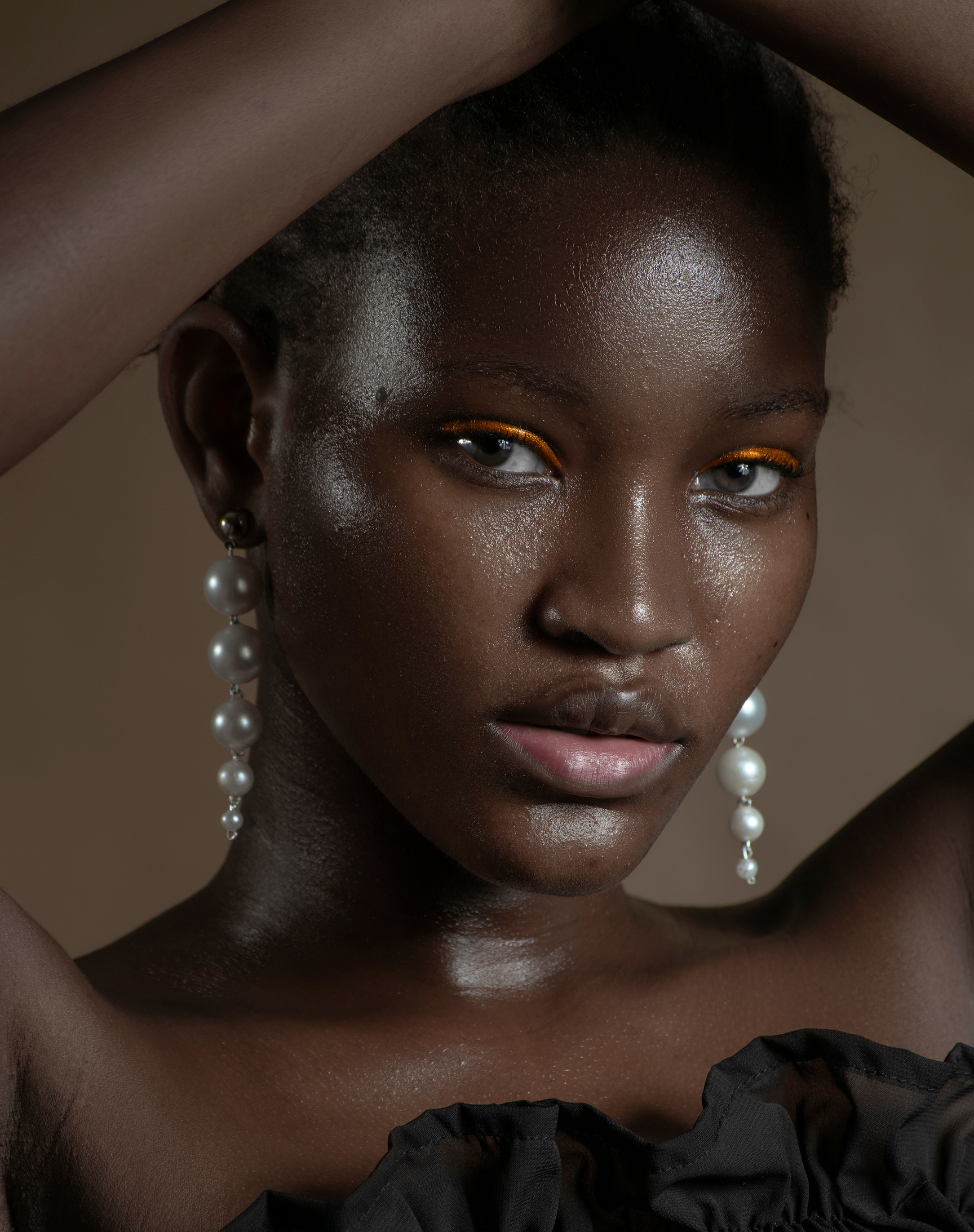 Gorgeous black woman with pearl earrings